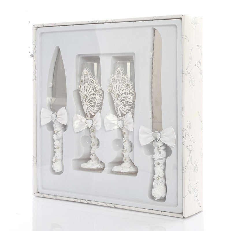 Four Piece Set Of Wine Glasses Knives And Forks